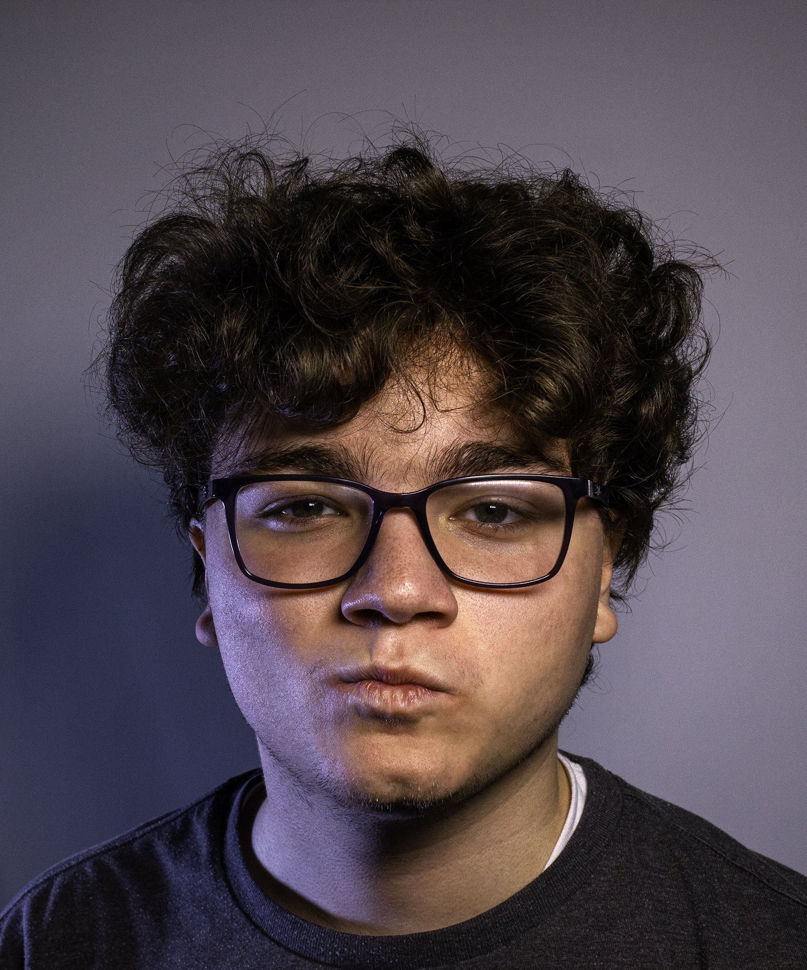 Portrait of Jacob Healt making a kissing face.