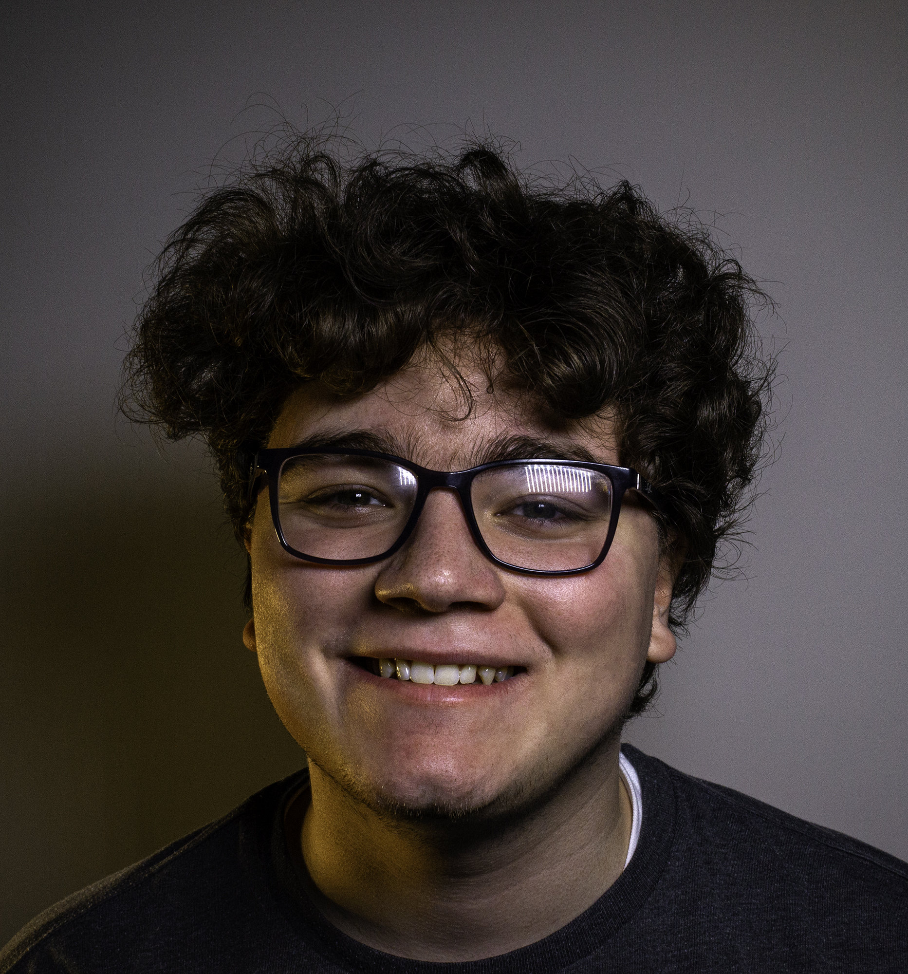 Portrait of Jacob Healt with a big smile.